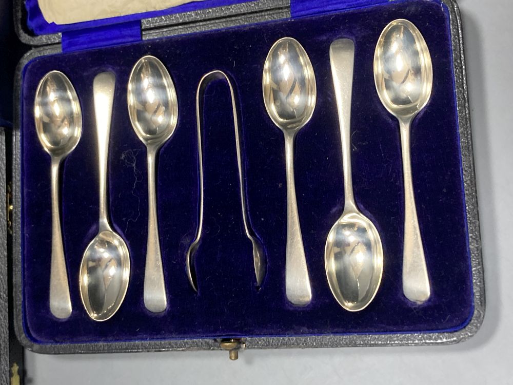 A cased pair of modern silver salt and pepper grinders, 74mm and two cased sets of six silver coffee spoons